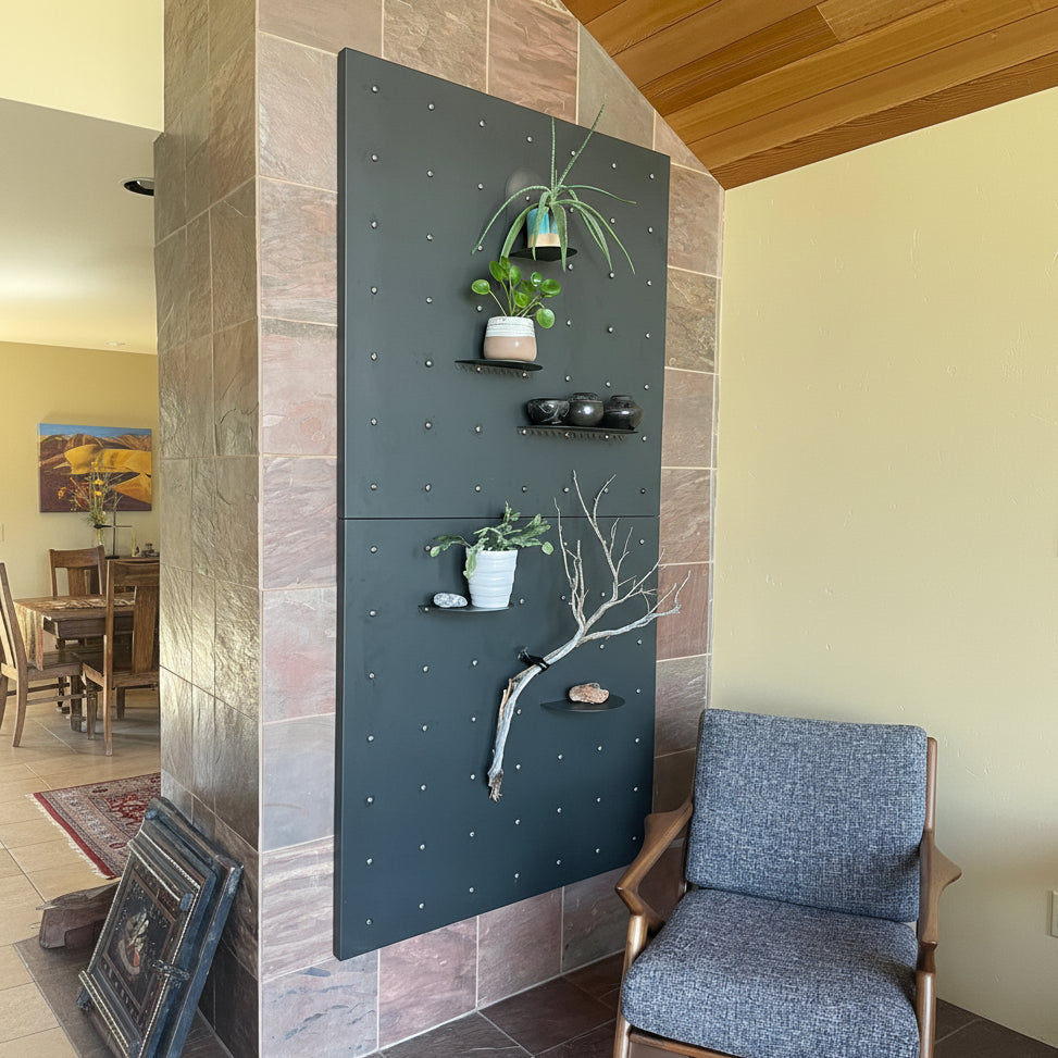 Decorative 42x42 wall panels with plants and shelves in a room with a chair and fireplace.