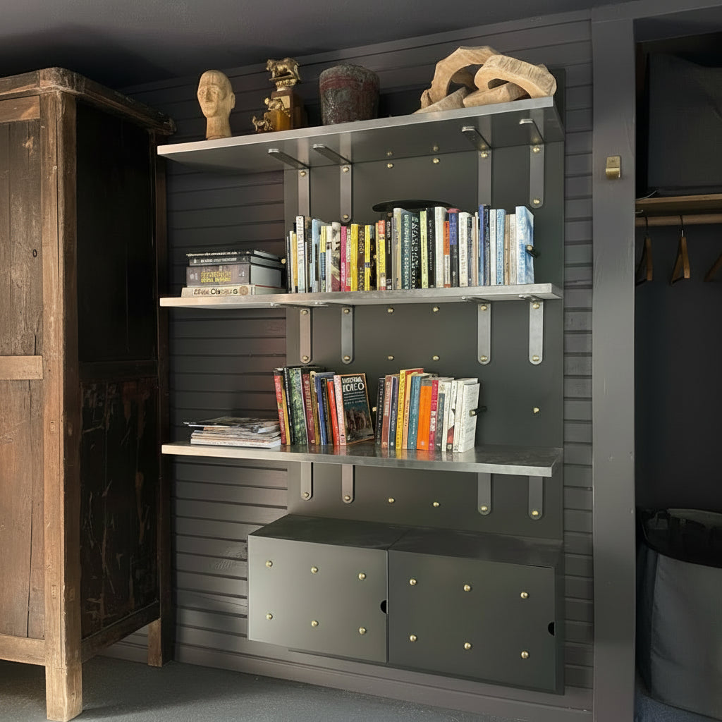 Curator Wall Panel arranged to create Bookshelves with books and decorative items against a dark wall.