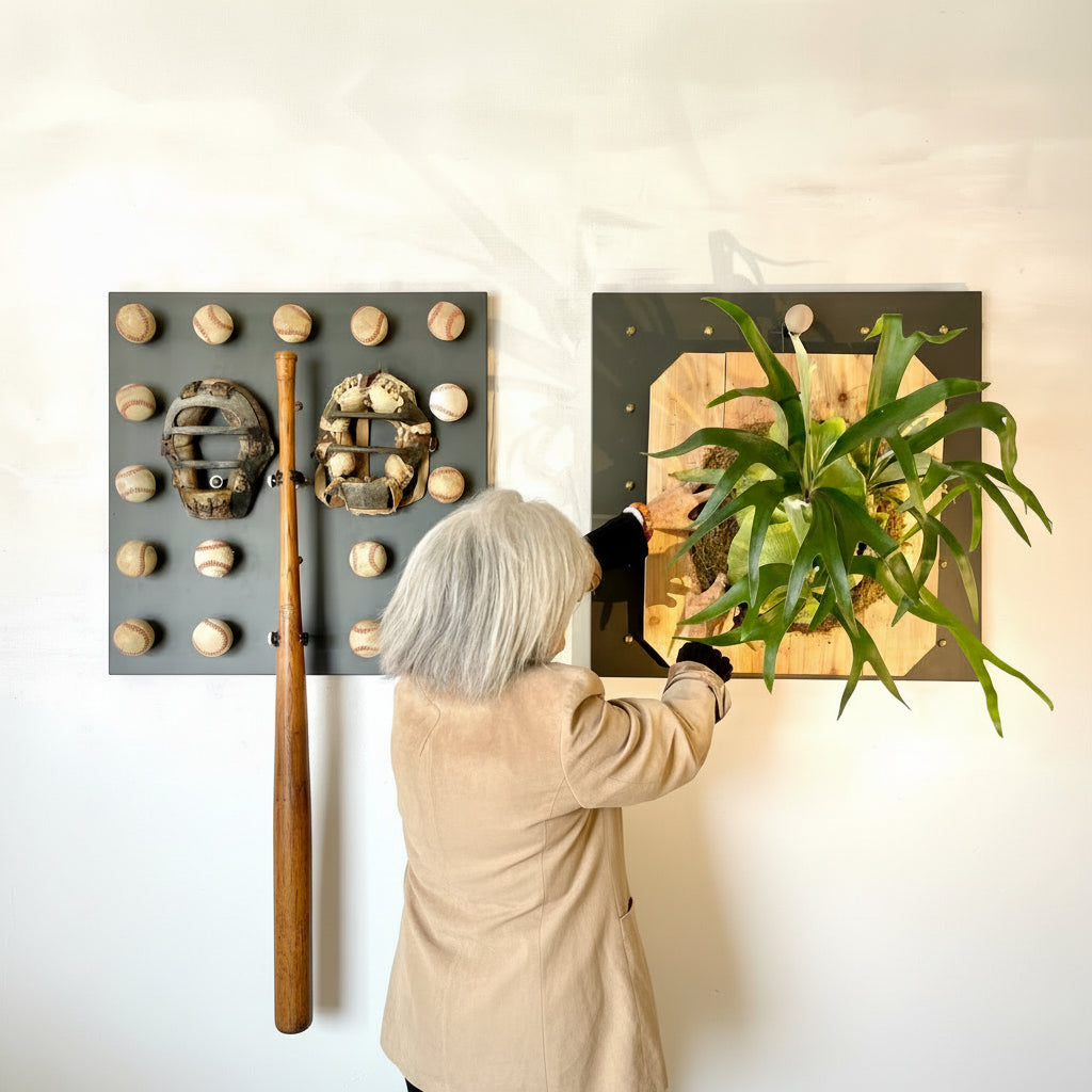 Person interacting with 30 x 30 Curator Wall panel featuring natural elements and a baseball motif. 