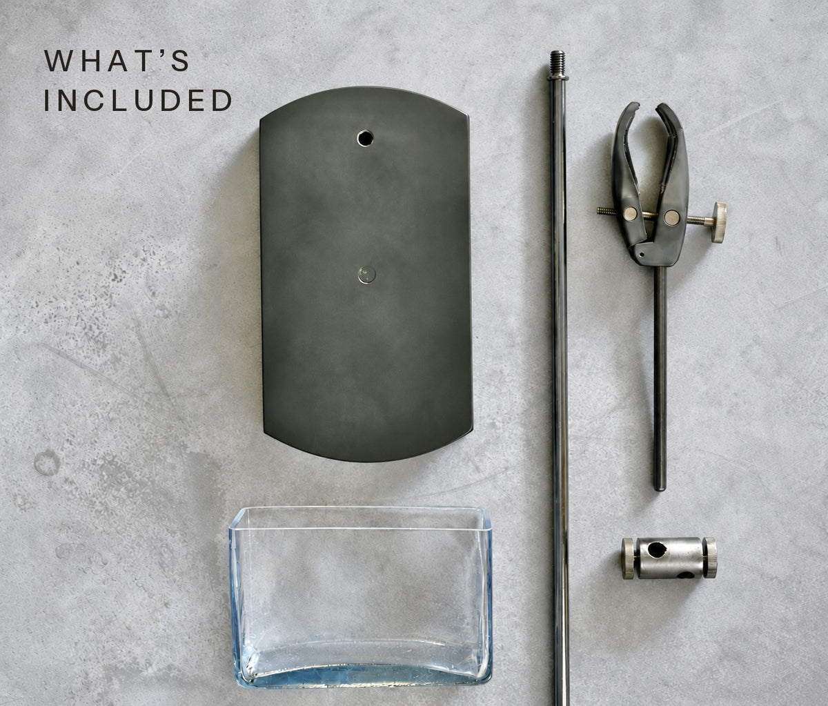 What's included: weighted base, chrome rod, soft grip clamp, connector and glass vase